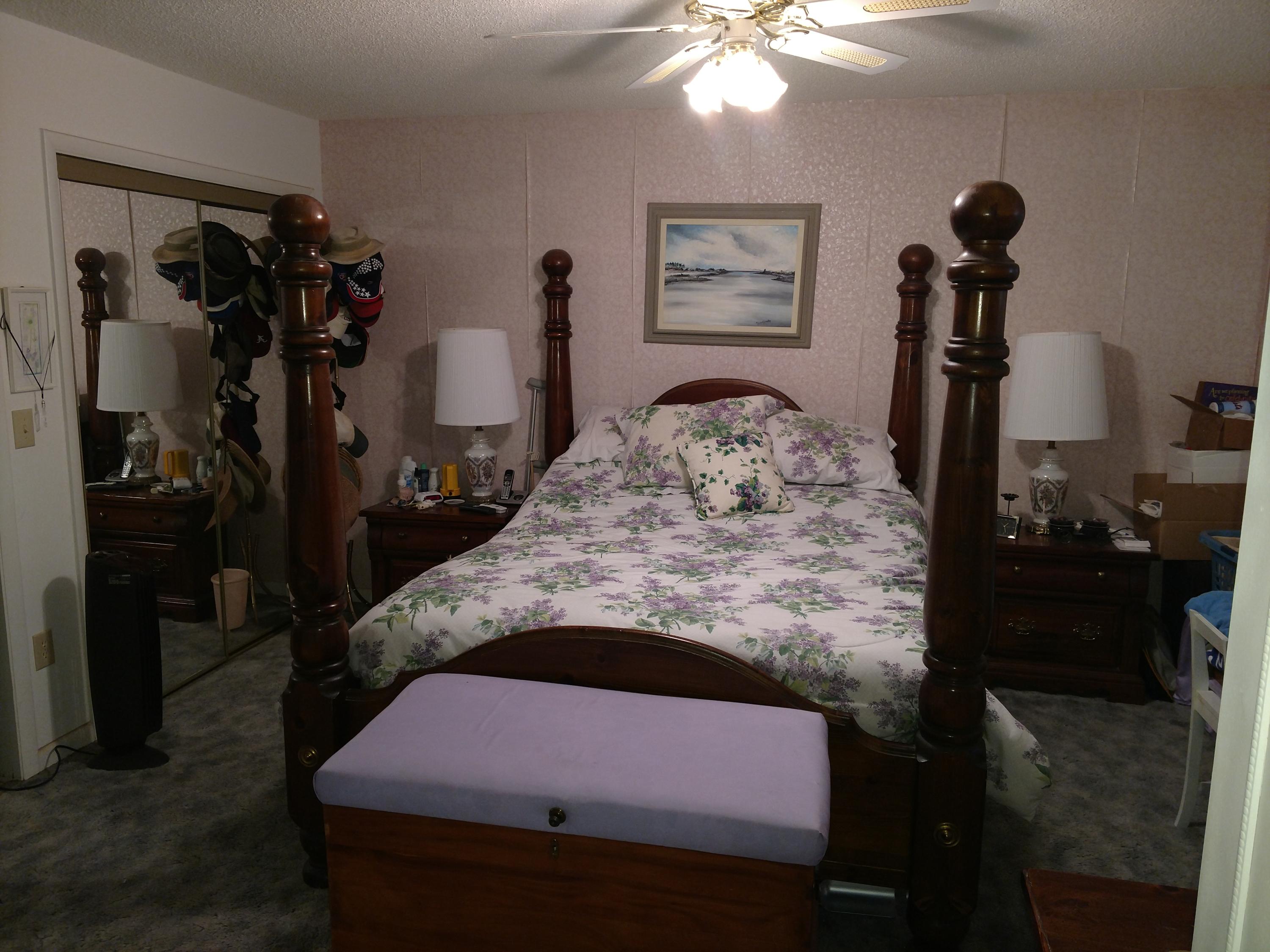 27 Choctawhatchee Road Southeast Fort Walton Beach, FL 32548 - Photo 14 of 20 a bedroom with a bed and a chandelier