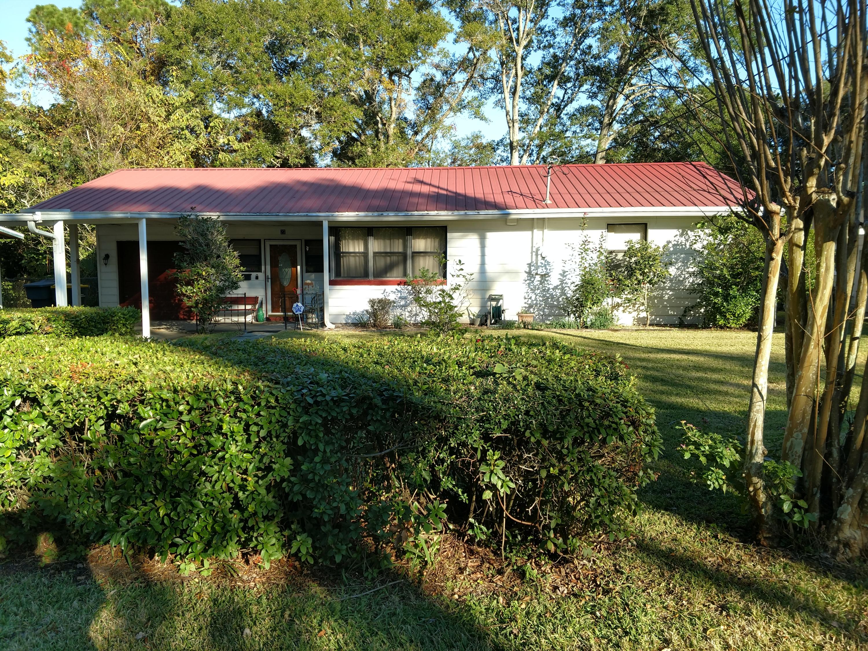 27 Choctawhatchee Road Southeast Fort Walton Beach, FL 32548 - Photo 2 of 20 a view of a house with a yard table and chairs
