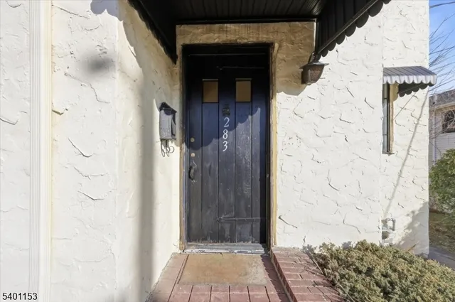 a view of a wooden door with a shower
