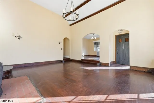 a view of a room with wooden floor