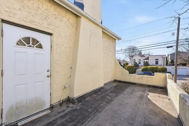 a view of a yard with plants and trees