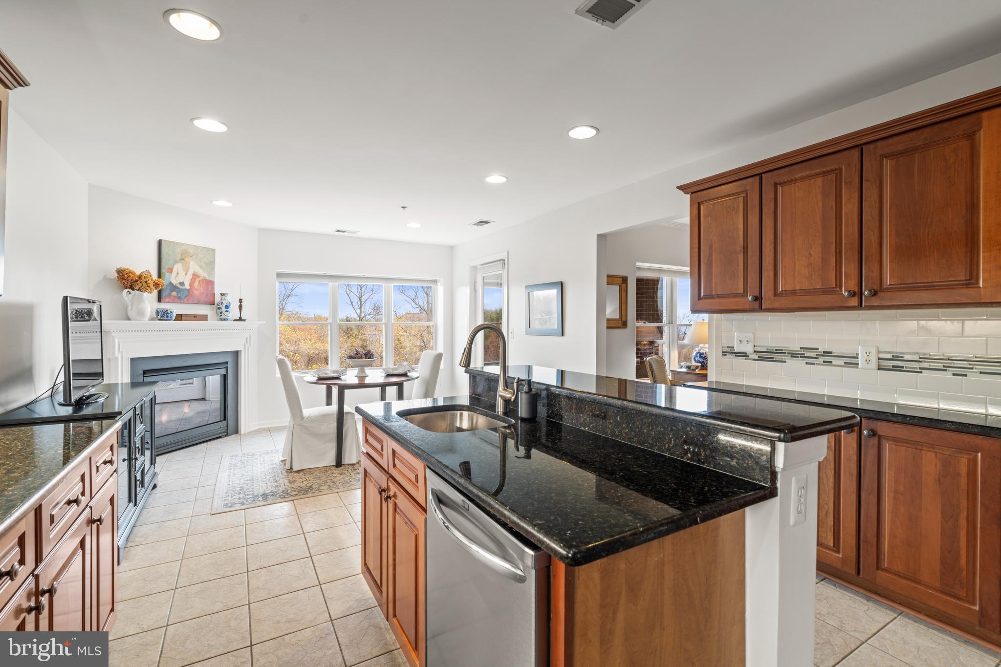 12246 Roundwood Road, Unit 507 Lutherville-Timonium, MD 21093 - Photo 19 of 58 Sunny Upgraded Granite Island Eat-in Kitchen