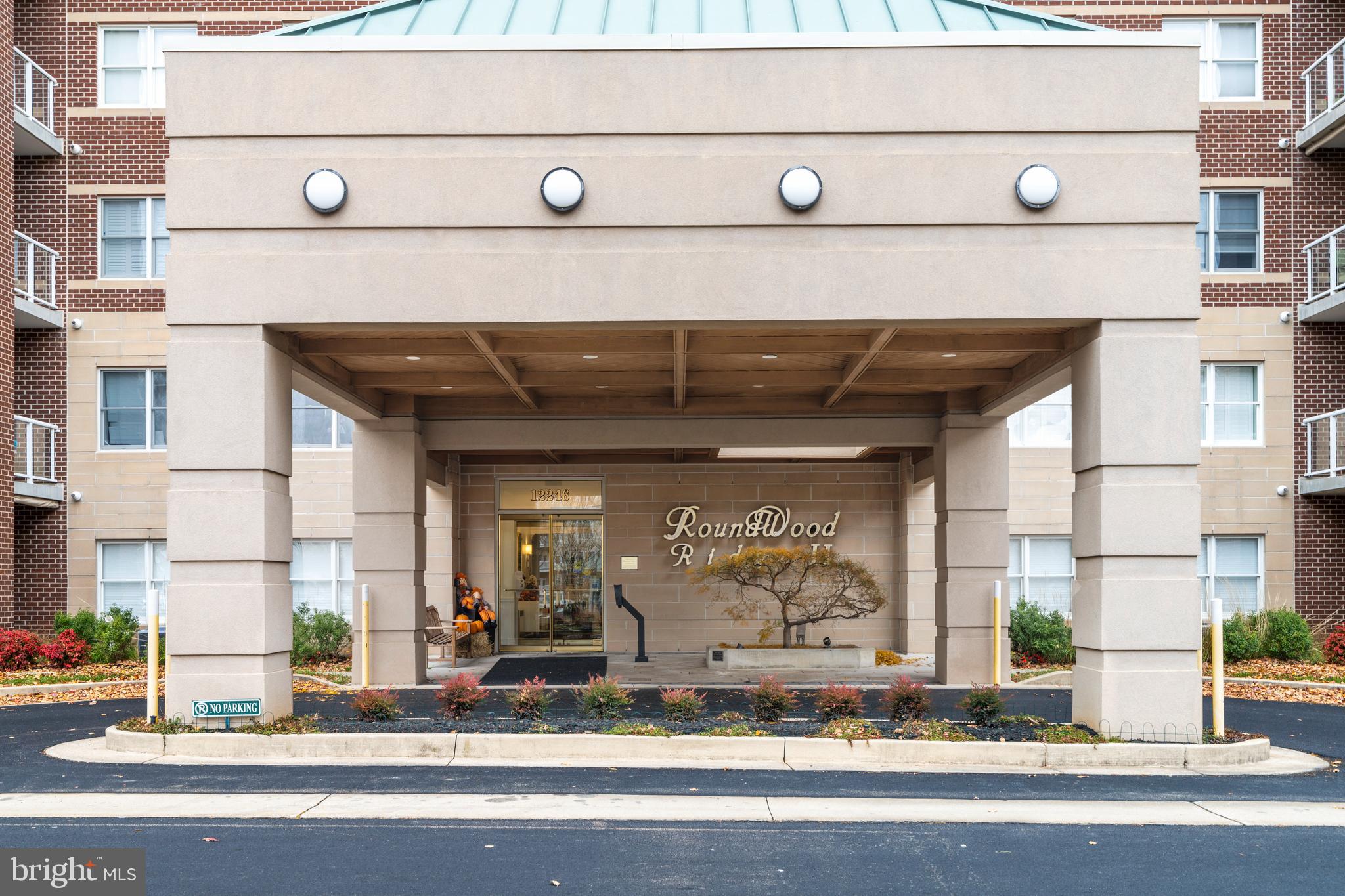 12246 Roundwood Road, Unit 507 Lutherville-Timonium, MD 21093 - Photo 2 of 58 Convenient Covered Entry and Pick Up Area