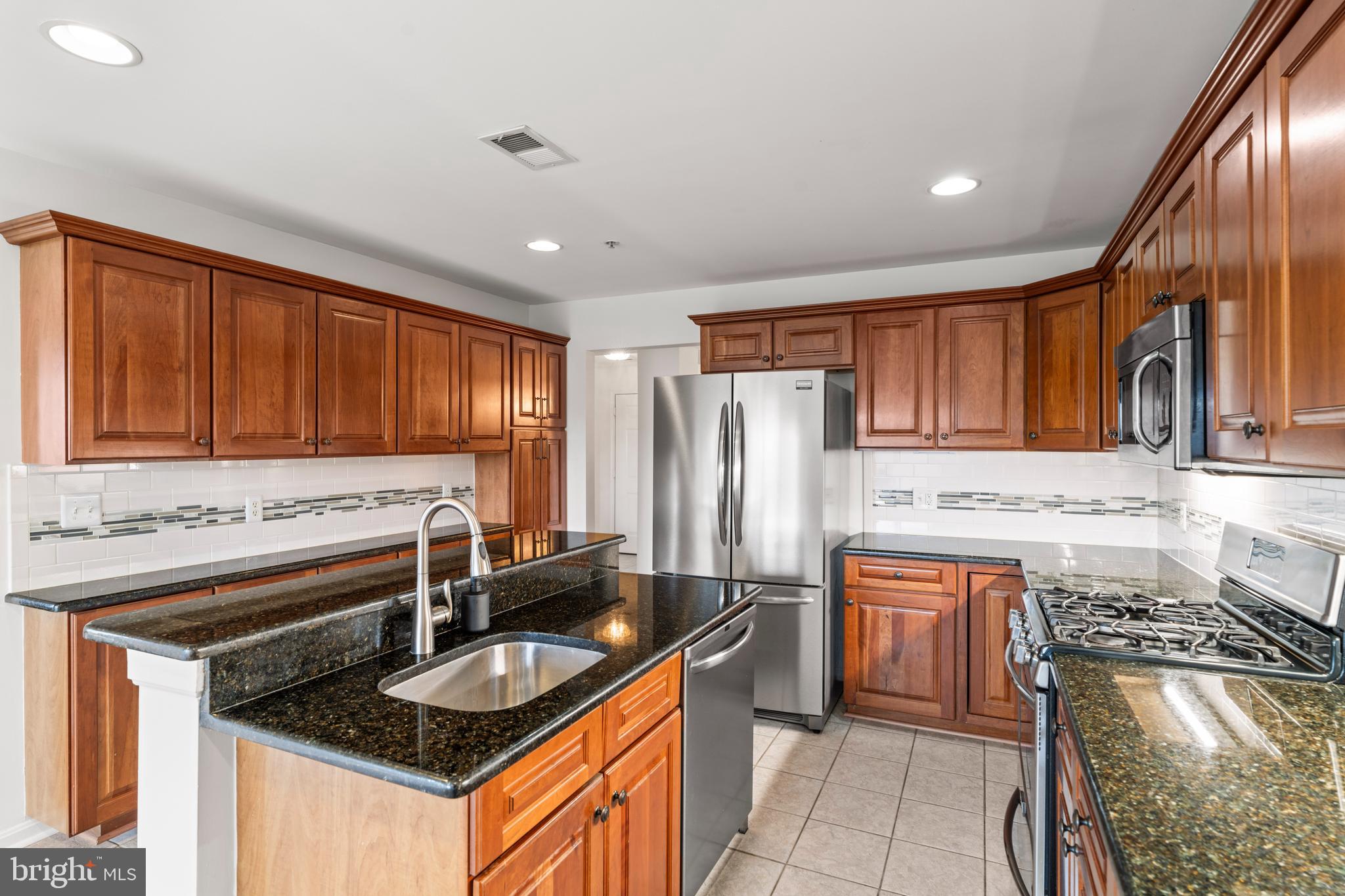 12246 Roundwood Road, Unit 507 Lutherville-Timonium, MD 21093 - Photo 21 of 58 Other Updates Include Glass Tile Back Splash