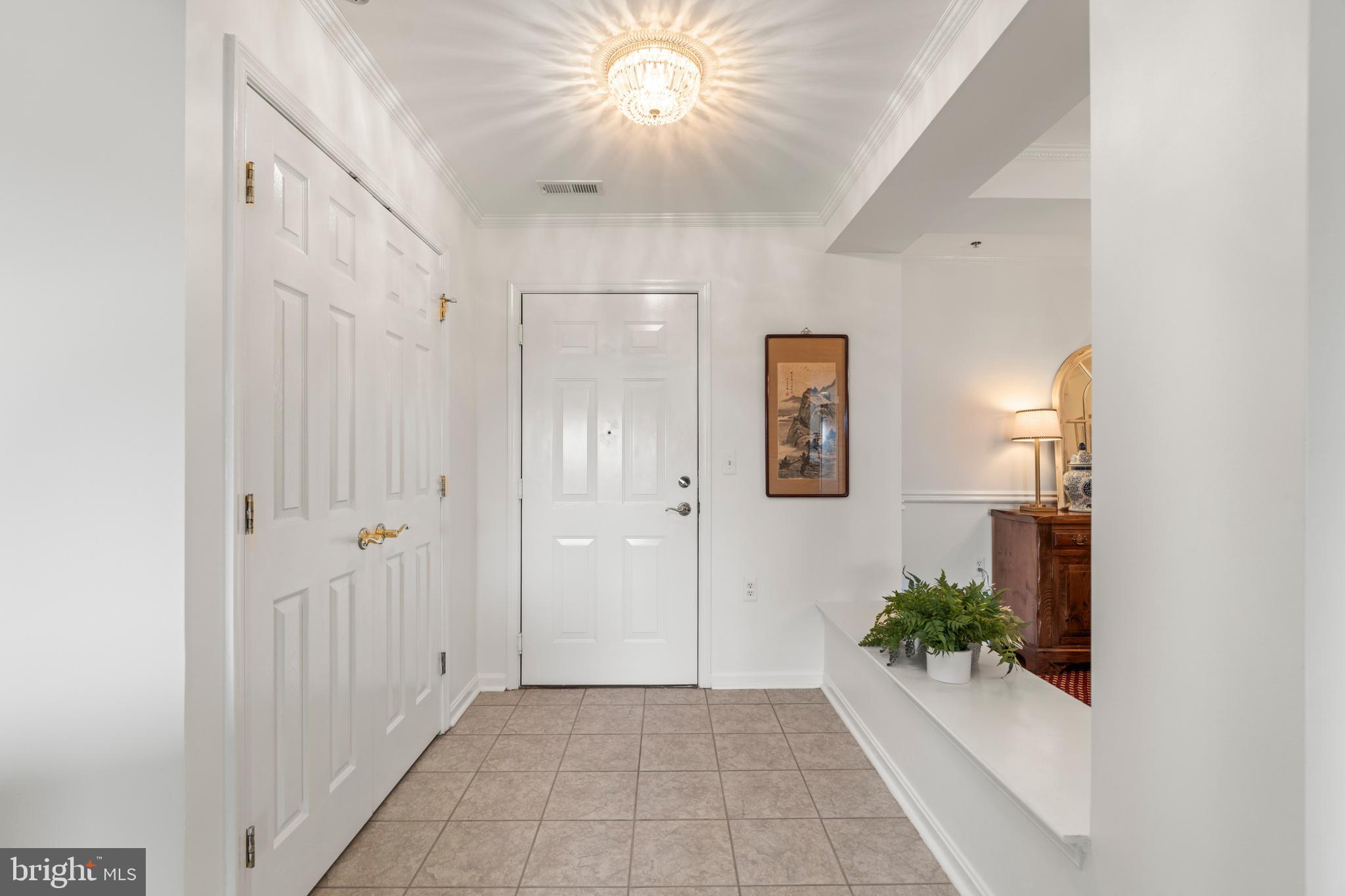 12246 Roundwood Road, Unit 507 Lutherville-Timonium, MD 21093 - Photo 10 of 58 Large Foyer Coat Closet & Open th the Dining Room