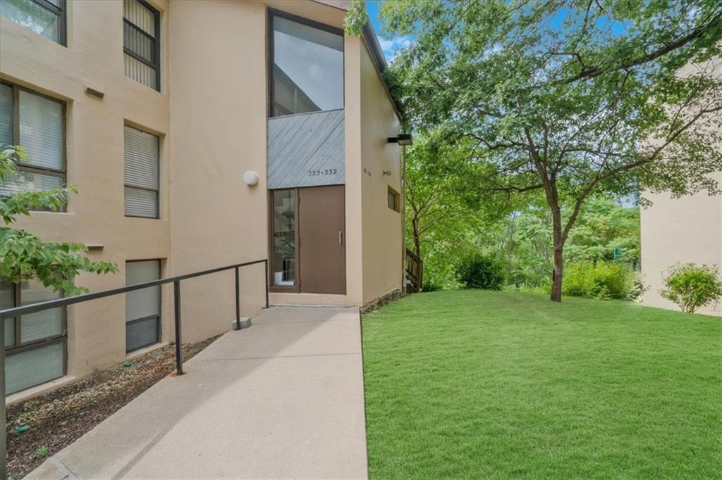 a view of a house with a backyard