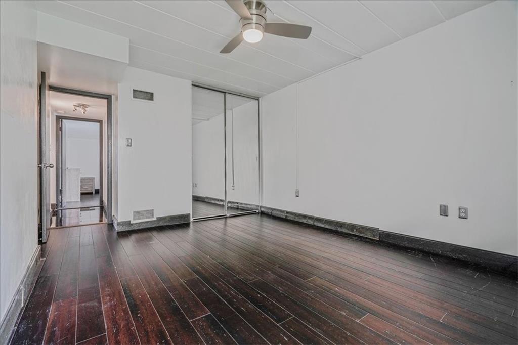 2034 Swallow Hill Road, Unit 328 Pittsburgh, PA 15220 - Photo 12 of 19 a view of a livingroom with wooden floor and a ceiling fan