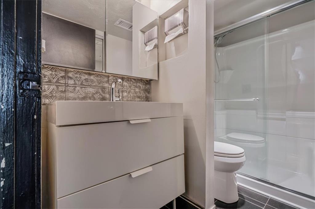 2034 Swallow Hill Road, Unit 328 Pittsburgh, PA 15220 - Photo 13 of 19 a bathroom with a sink toilet and shower