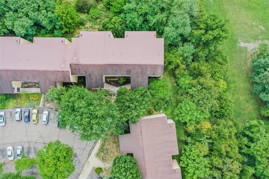 2034 Swallow Hill Road, Unit 328 Pittsburgh, PA 15220 - Photo 15 of 19 an aerial view of a house with a yard and trees all around