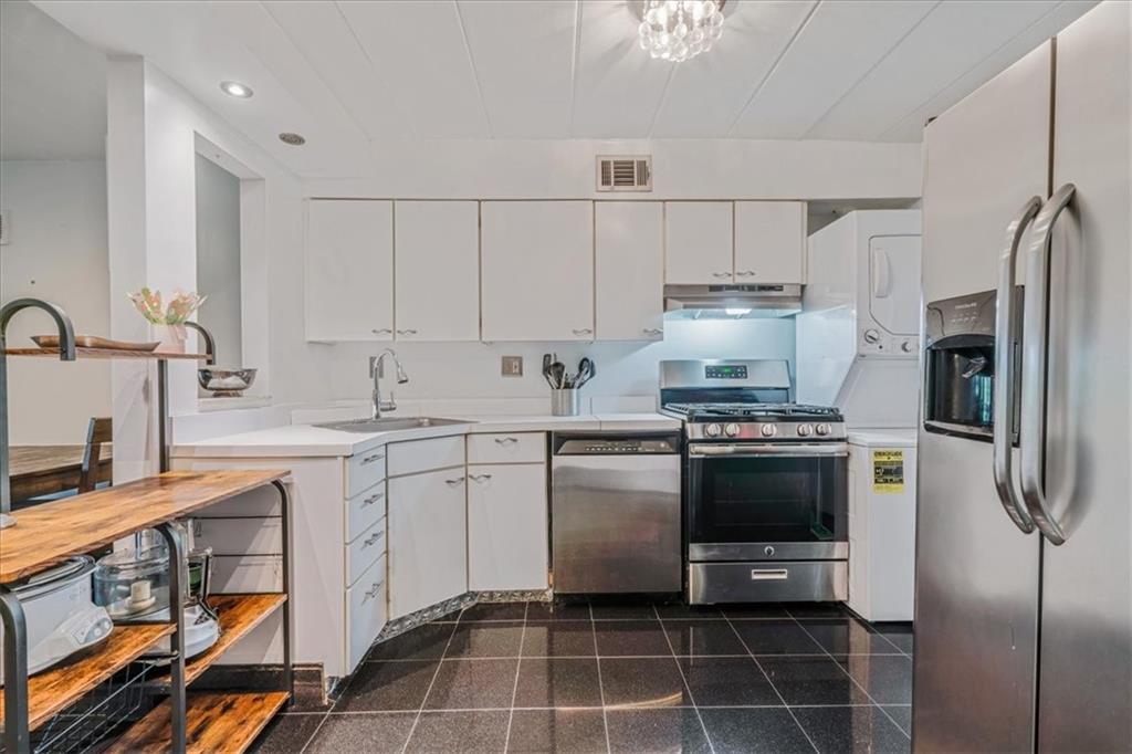 2034 Swallow Hill Road, Unit 328 Pittsburgh, PA 15220 - Photo 3 of 19 a kitchen with a sink appliances and cabinets