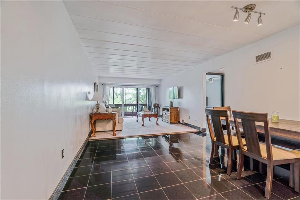 2034 Swallow Hill Road, Unit 328 Pittsburgh, PA 15220 - Photo 4 of 19 a room with lots of tables a large window and chairs