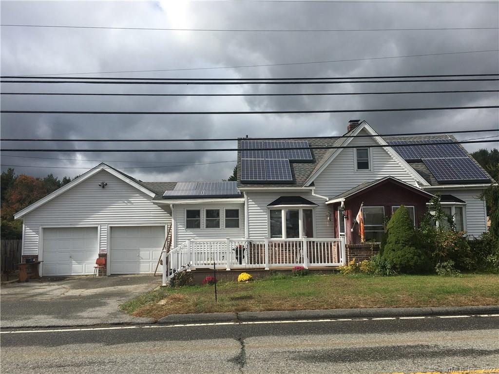 989 Norwich Road Plainfield, CT 06374 - Photo 1 of 1 a view of a house with a small garden