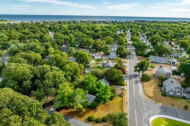 an aerial view of a house with a yard
