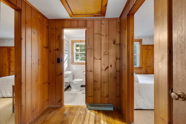 a view of a bathroom with a glass door shower and a mirror