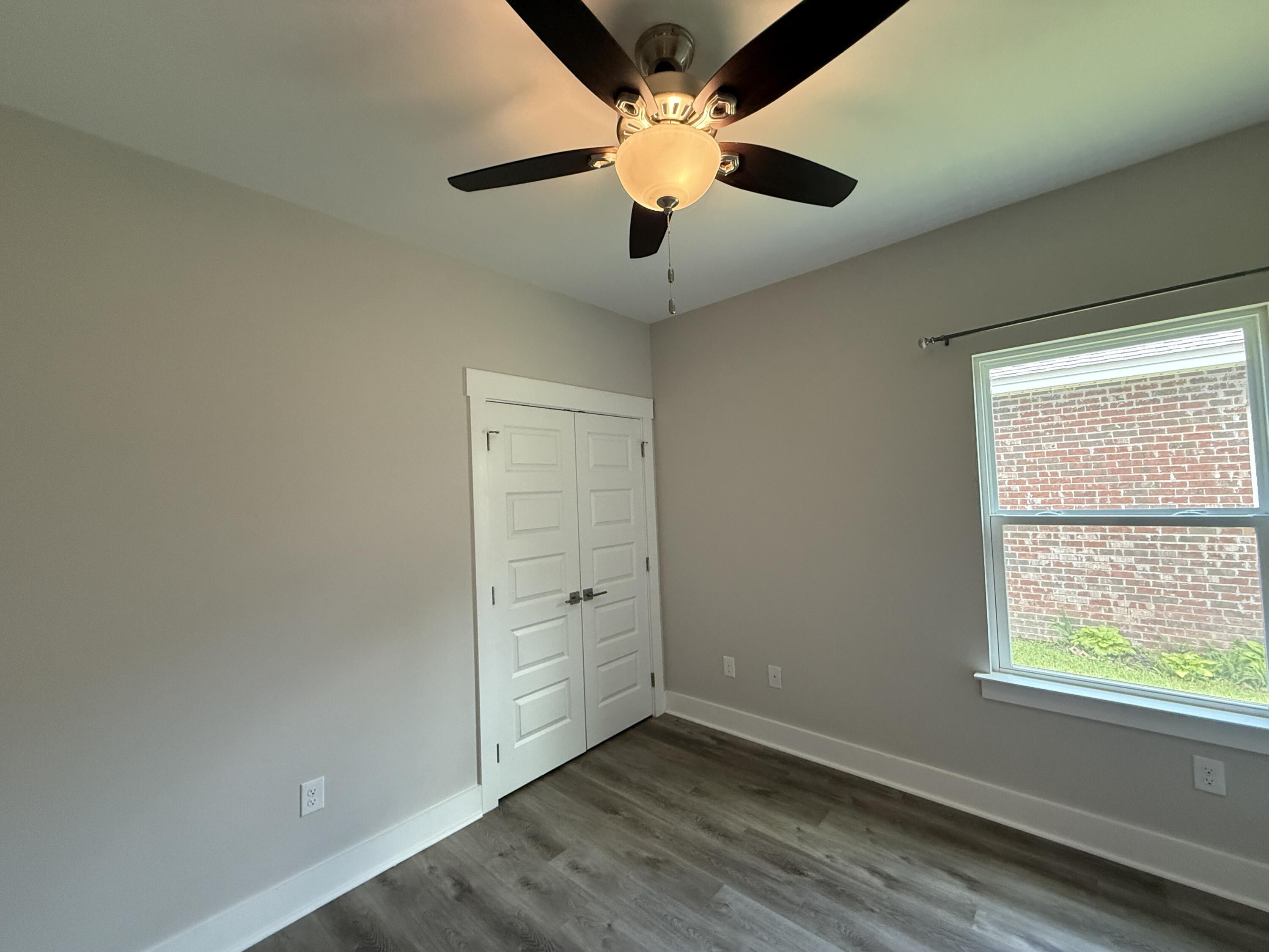 72 Wolverine Avenue Valparaiso, FL 32580 - Photo 13 of 20 an empty room with windows and ceiling fan