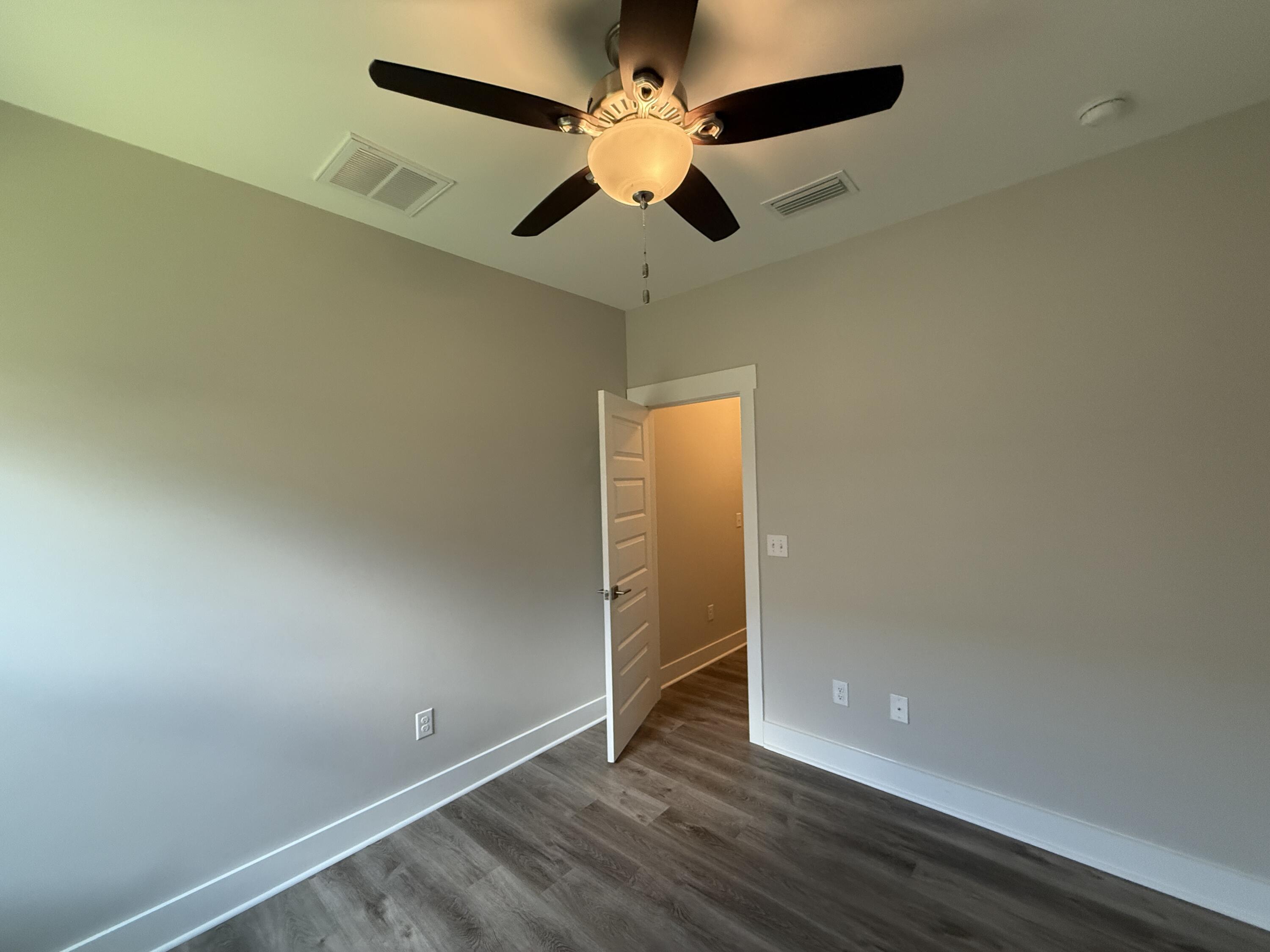 72 Wolverine Avenue Valparaiso, FL 32580 - Photo 14 of 20 an empty room with wooden floor closet and ceiling fan