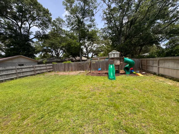 a view of a swimming pool with a bench