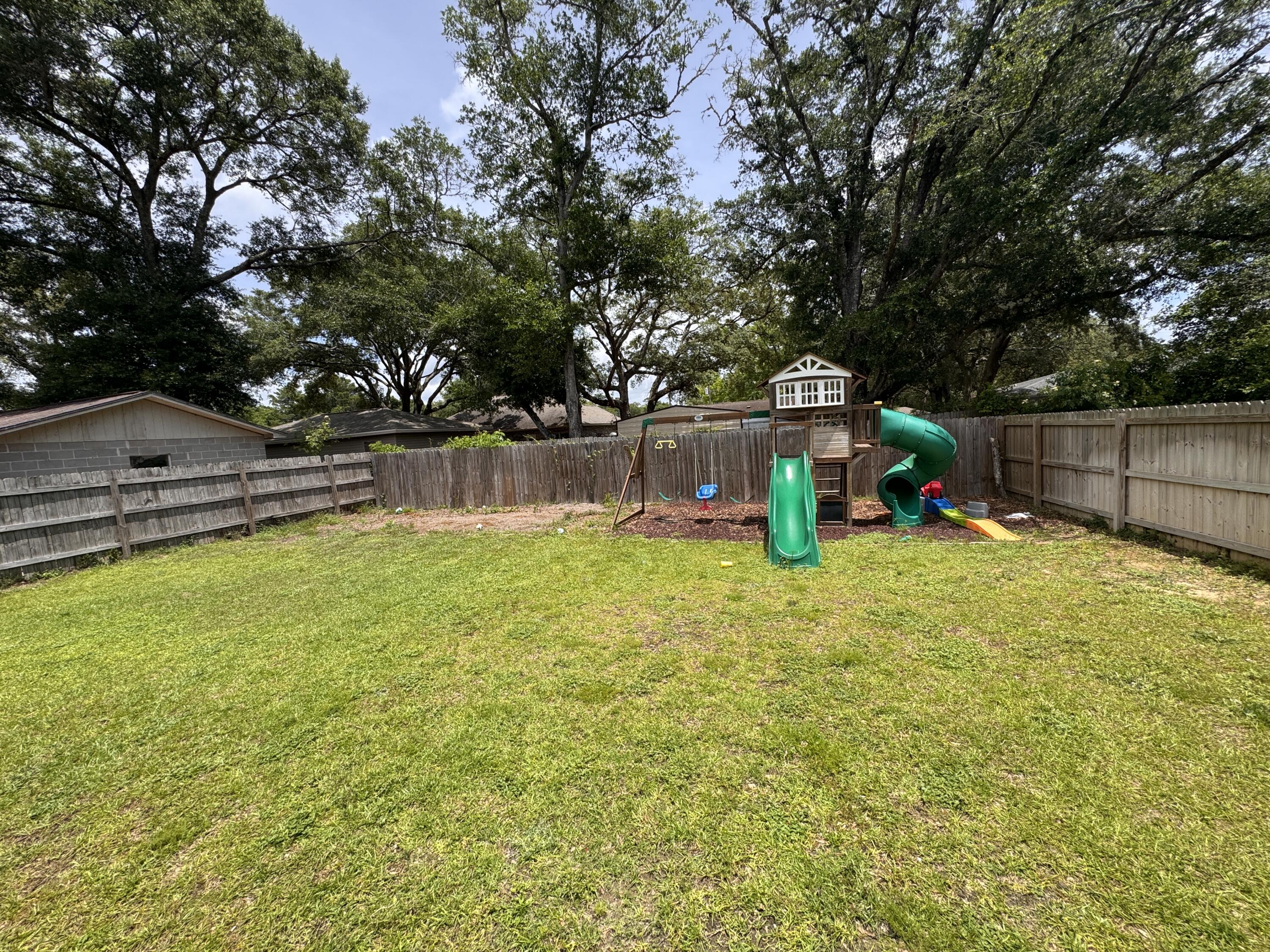 72 Wolverine Avenue Valparaiso, FL 32580 - Photo 19 of 20 a view of a swimming pool with a bench