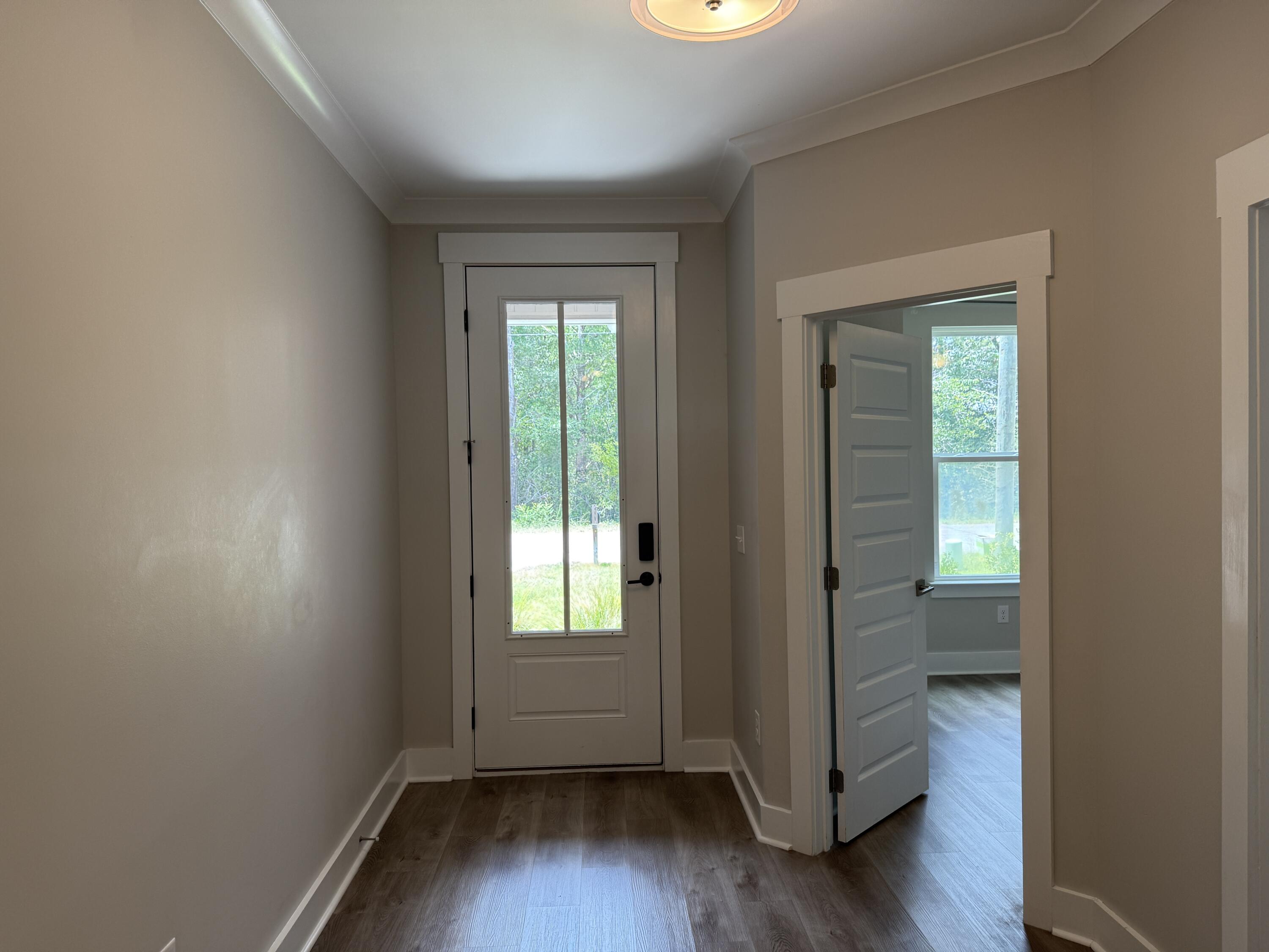 72 Wolverine Avenue Valparaiso, FL 32580 - Photo 4 of 20 an empty room with wooden floor and a window
