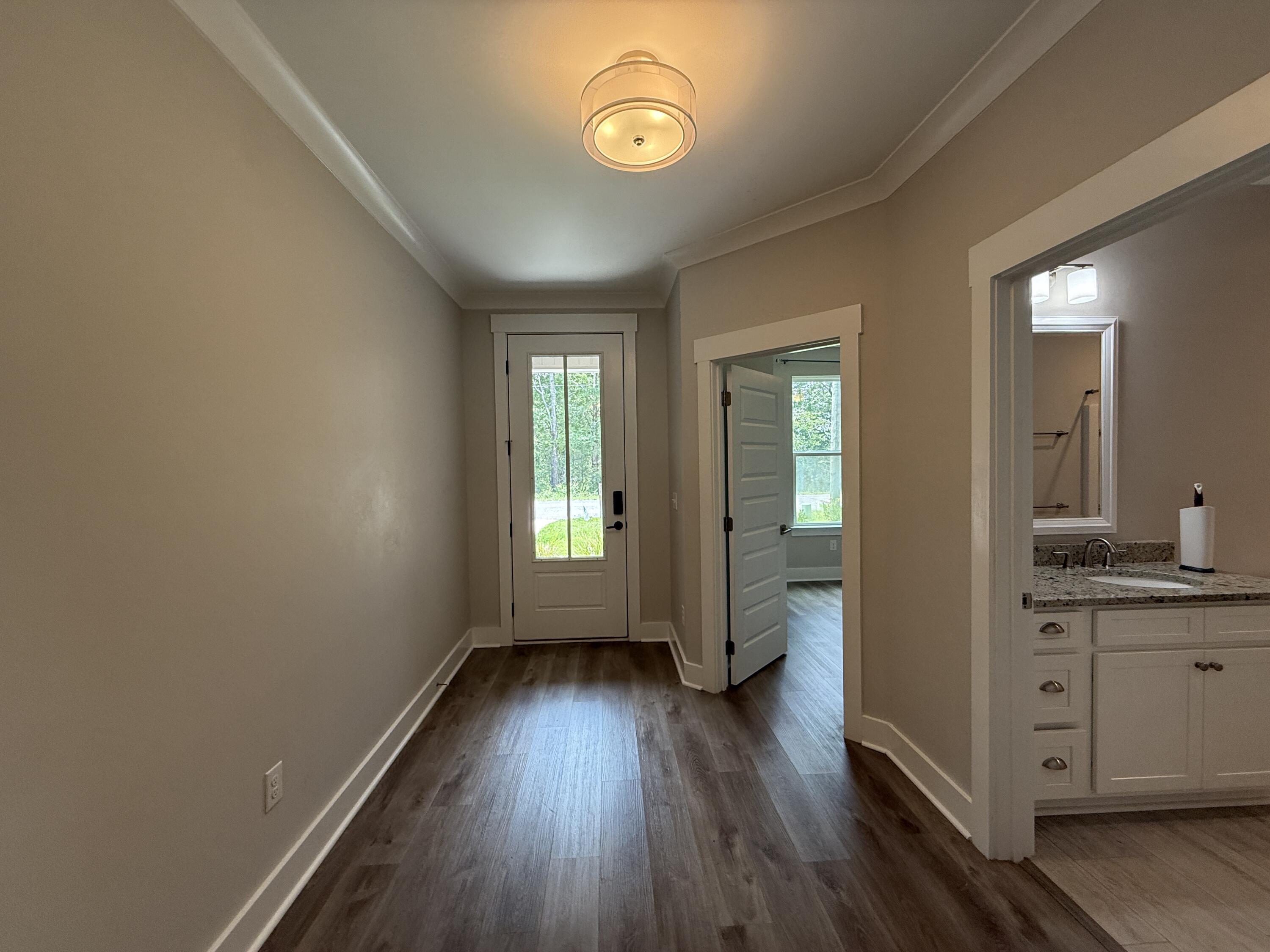 72 Wolverine Avenue Valparaiso, FL 32580 - Photo 5 of 20 wooden floor in an empty room with a window