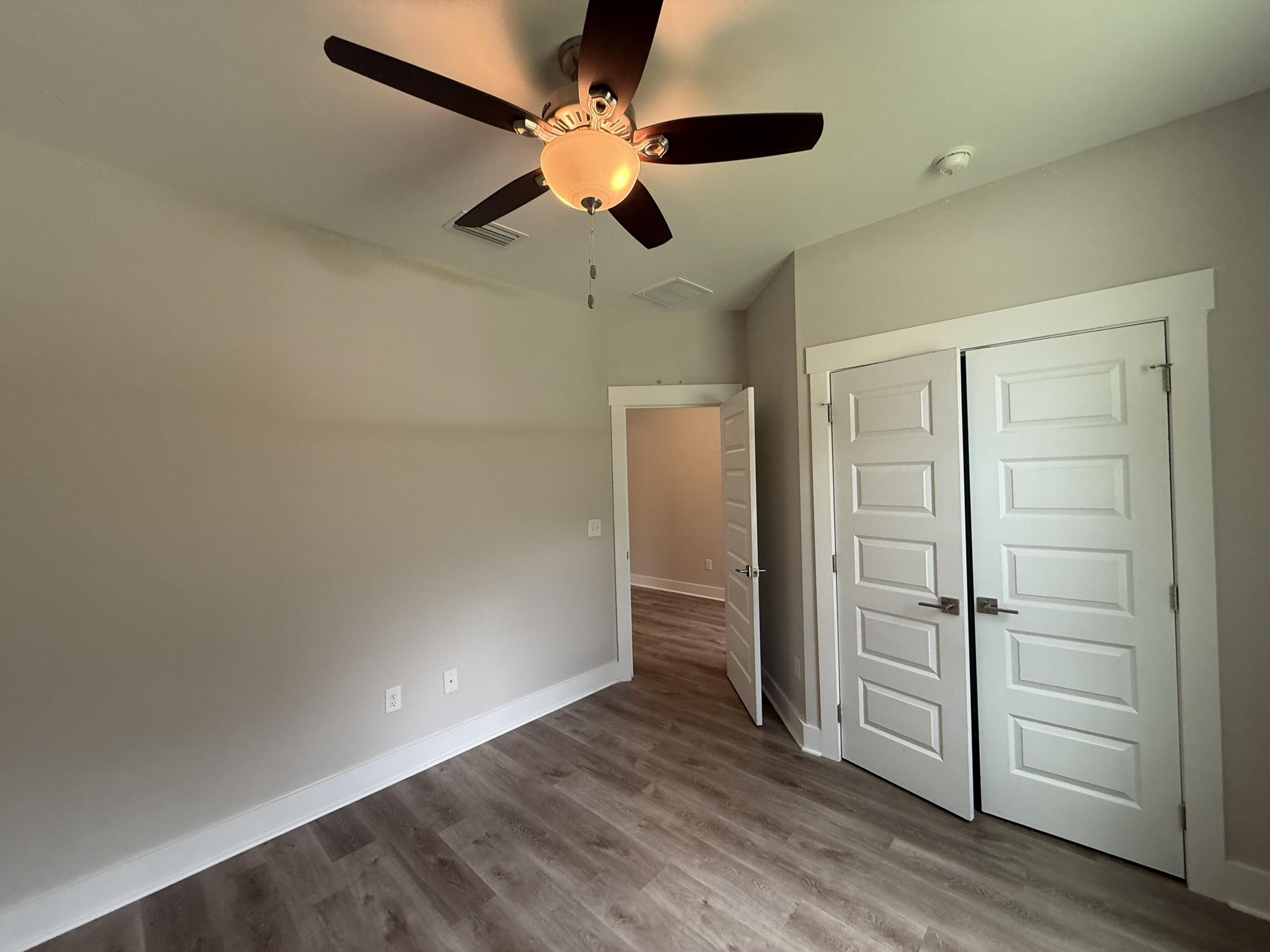72 Wolverine Avenue Valparaiso, FL 32580 - Photo 8 of 20 wooden floor in an empty room