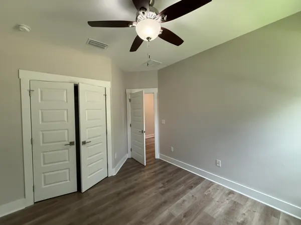 an empty room with wooden floor