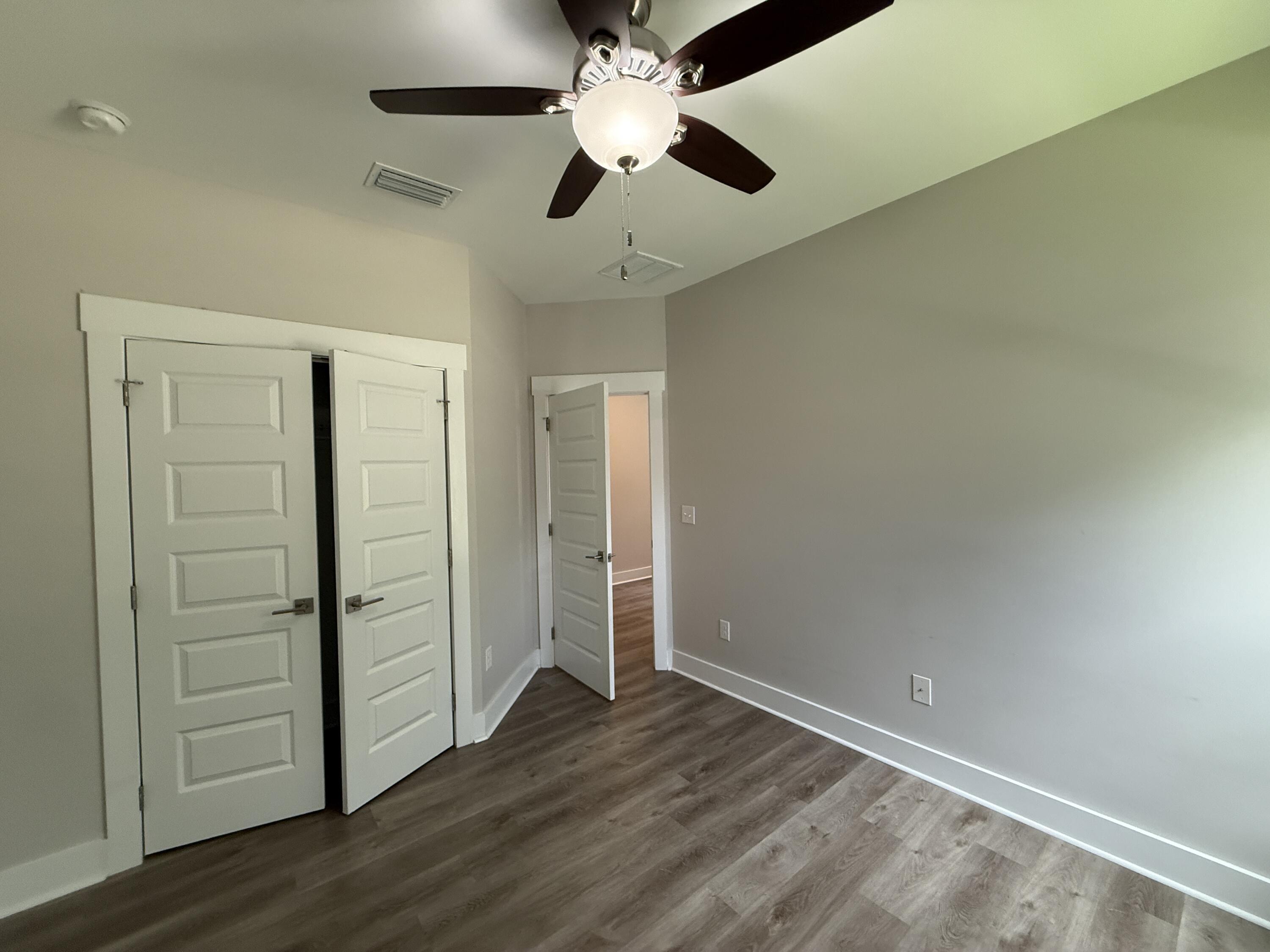 72 Wolverine Avenue Valparaiso, FL 32580 - Photo 9 of 20 an empty room with wooden floor