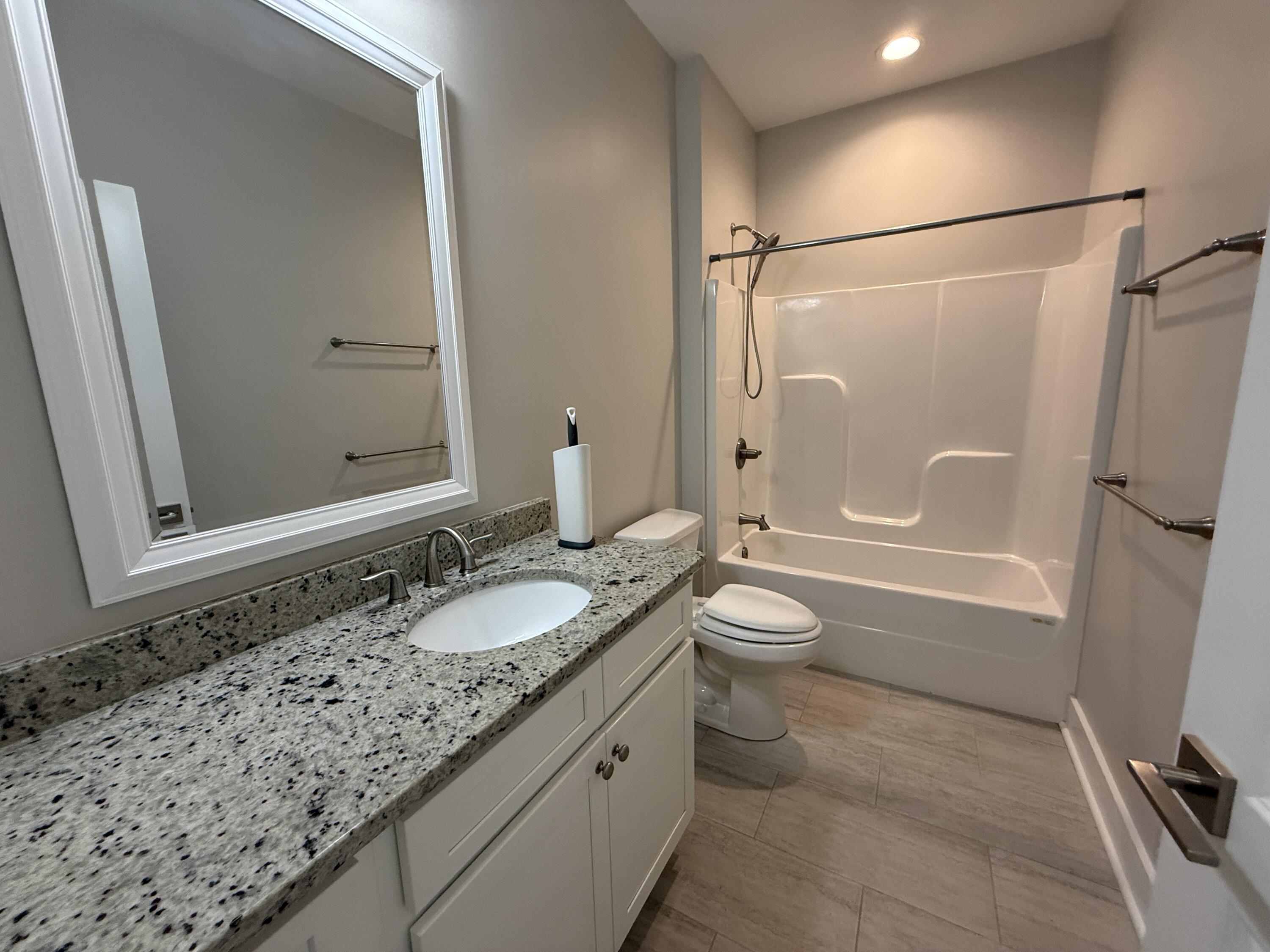 72 Wolverine Avenue Valparaiso, FL 32580 - Photo 10 of 20 a bathroom with a granite countertop sink toilet and shower