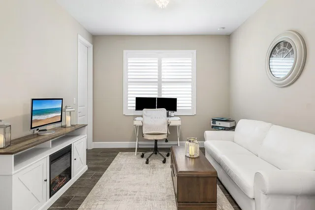 an aerial view of a house with swimming pool garden and patio