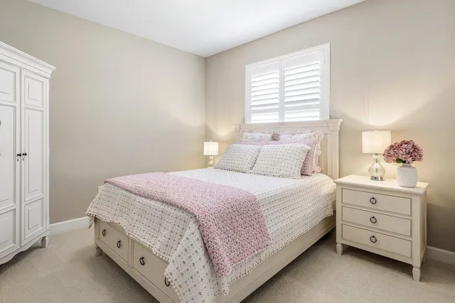 an aerial view of residential houses with yard