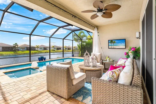a view of a swimming pool with a table and chairs