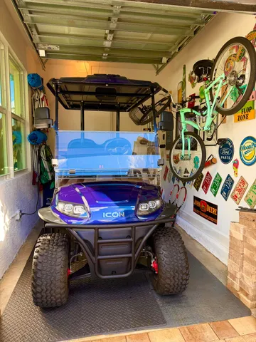 a view of a dining room with furniture a chandelier and window