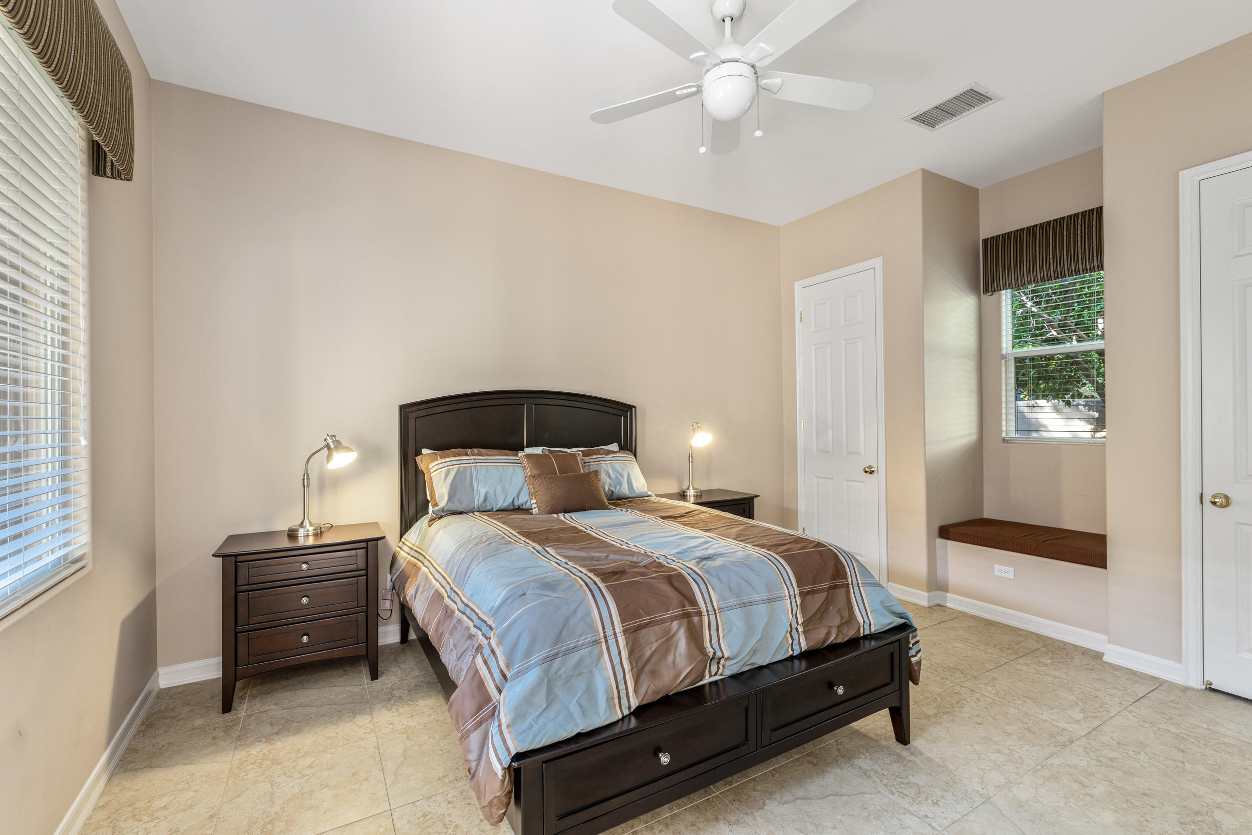 360 Loch Lomond Road Rancho Mirage, CA 92270 - Photo 13 of 76 a bedroom with a bed and a window
