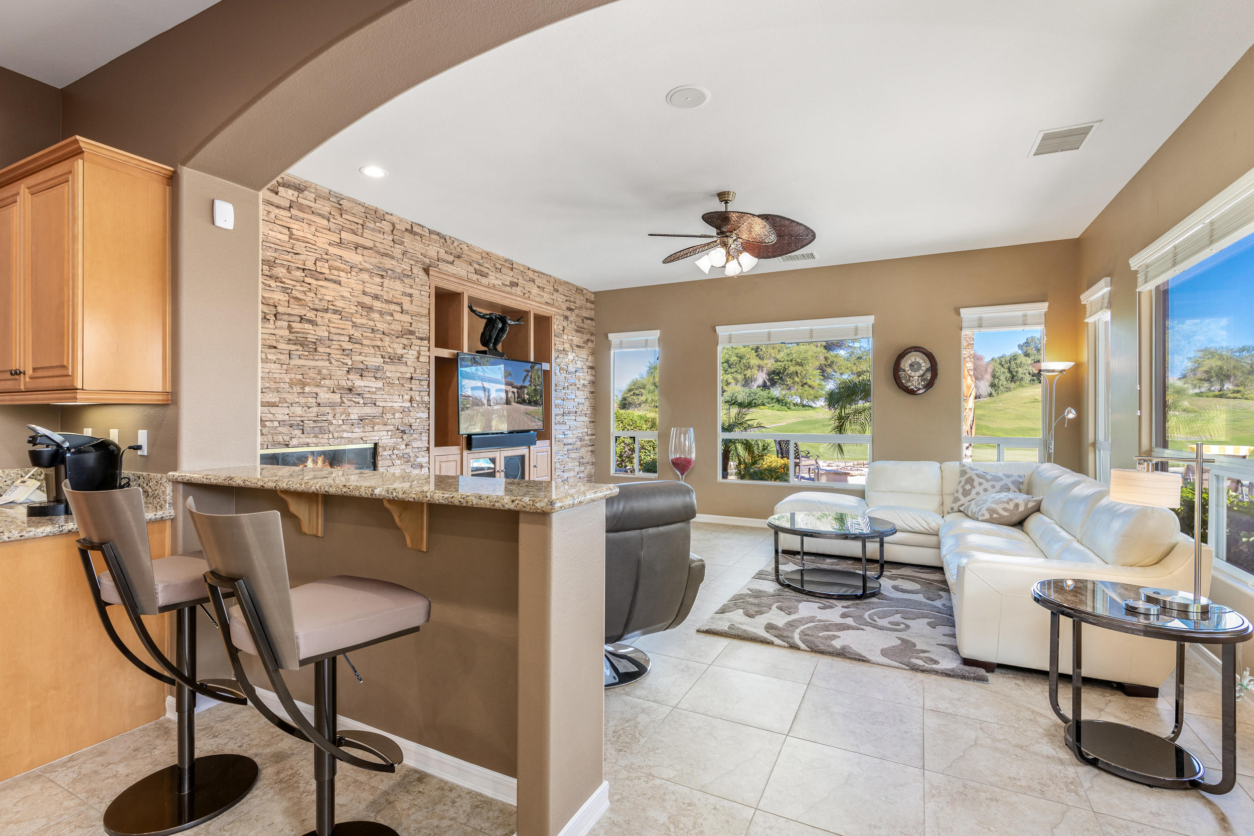 360 Loch Lomond Road Rancho Mirage, CA 92270 - Photo 17 of 76 a living room with furniture and a large window