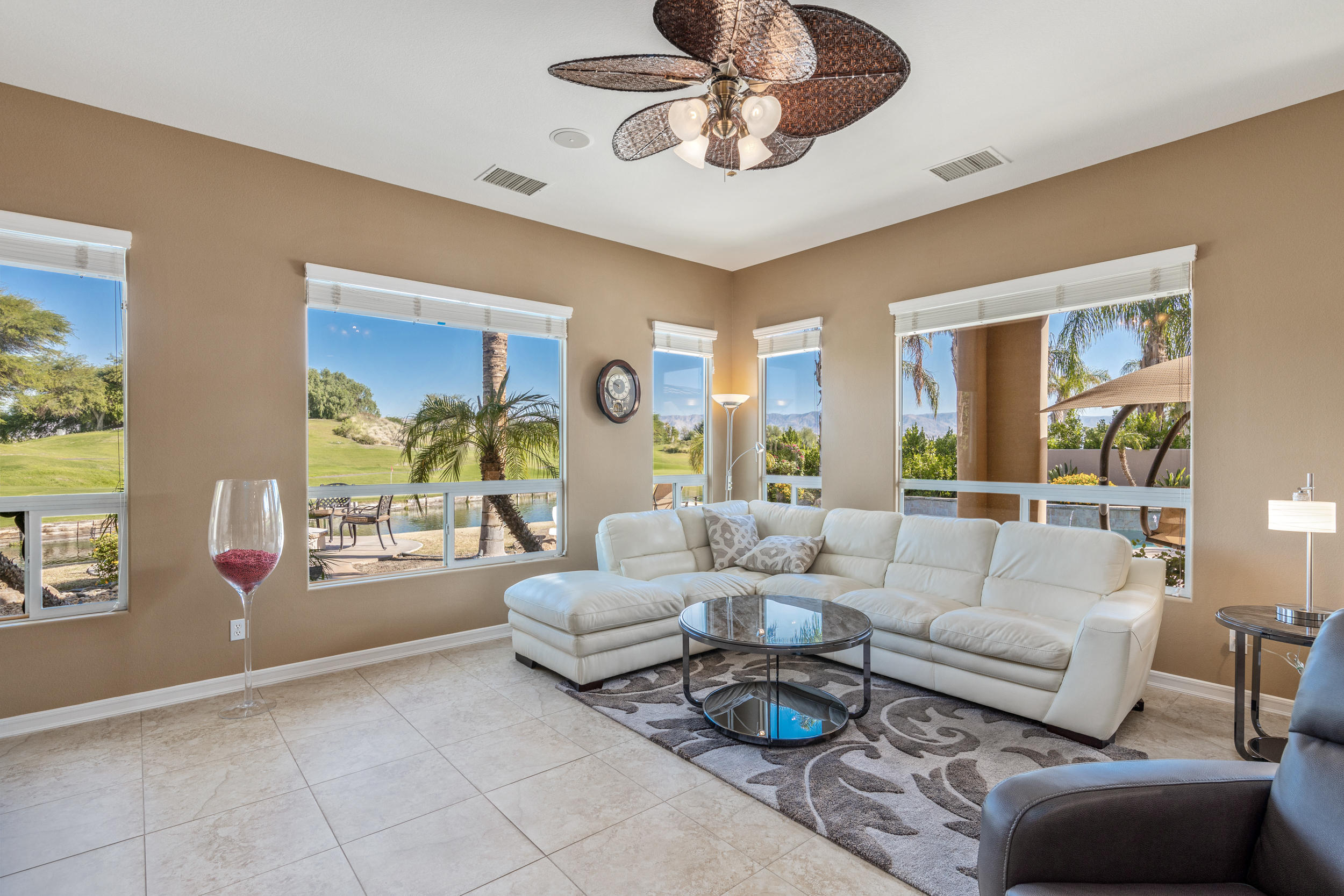 360 Loch Lomond Road Rancho Mirage, CA 92270 - Photo 19 of 76 a living room with furniture and a large window