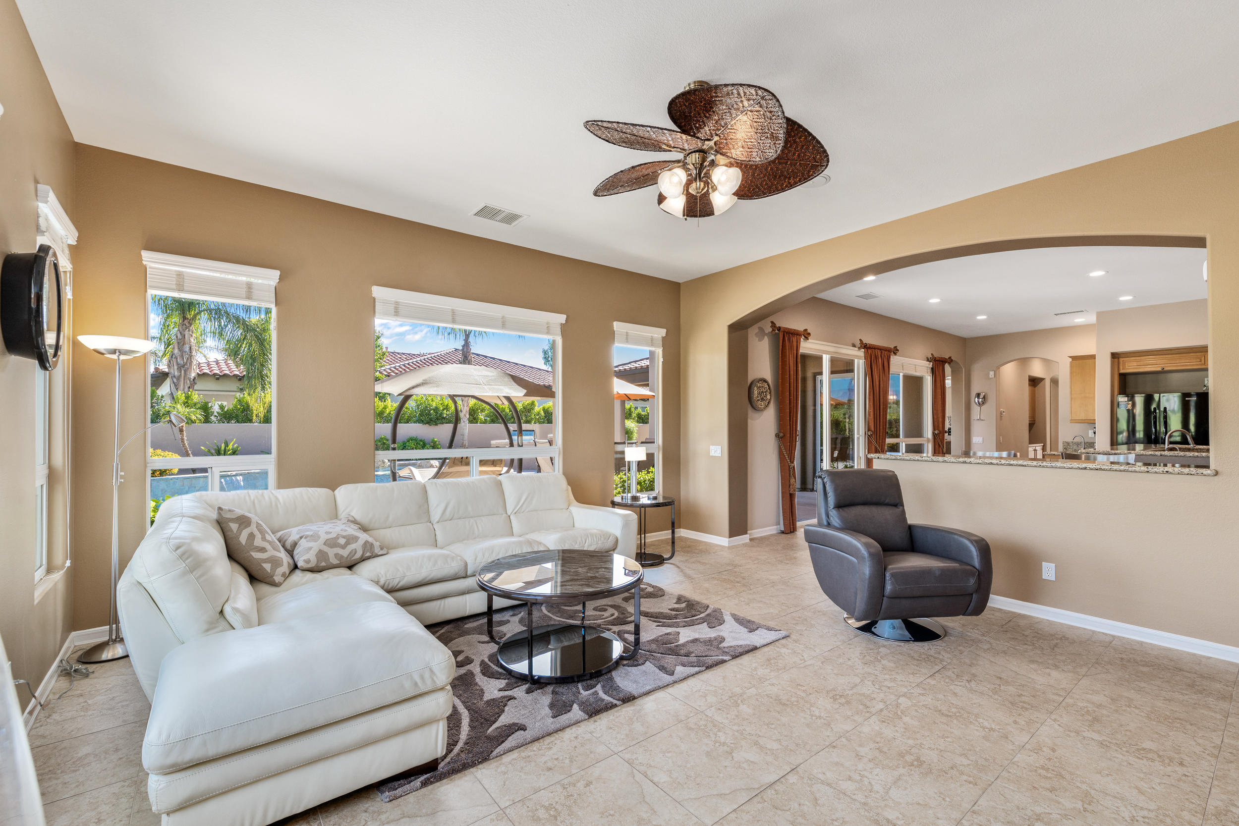 360 Loch Lomond Road Rancho Mirage, CA 92270 - Photo 20 of 76 a living room with furniture and a large window