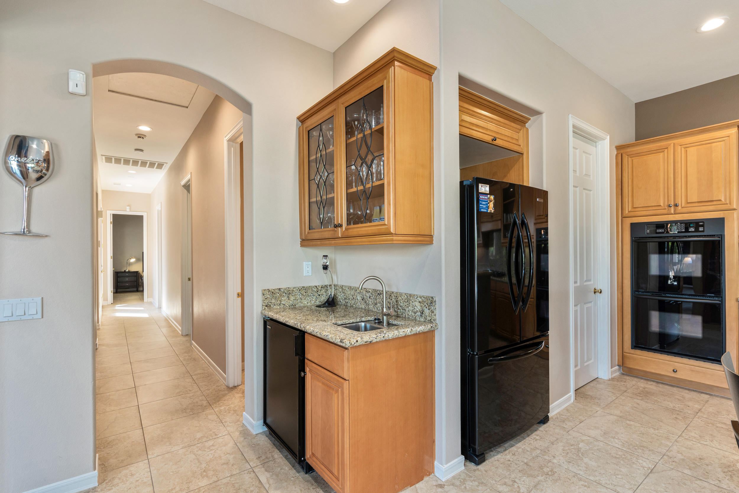 360 Loch Lomond Road Rancho Mirage, CA 92270 - Photo 21 of 76 a kitchen with stainless steel appliances granite countertop a refrigerator and a stove