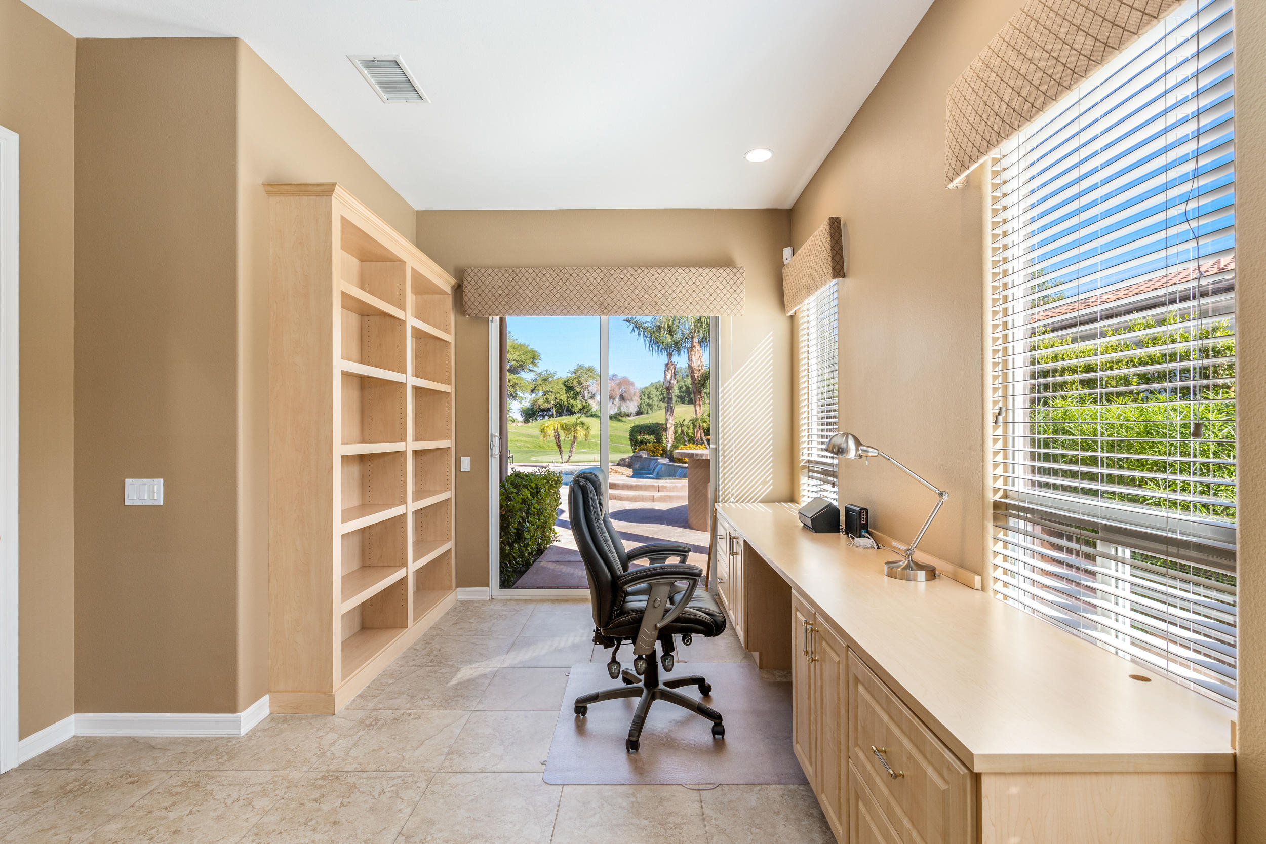 360 Loch Lomond Road Rancho Mirage, CA 92270 - Photo 22 of 76 a view of a workspace with furniture and a window
