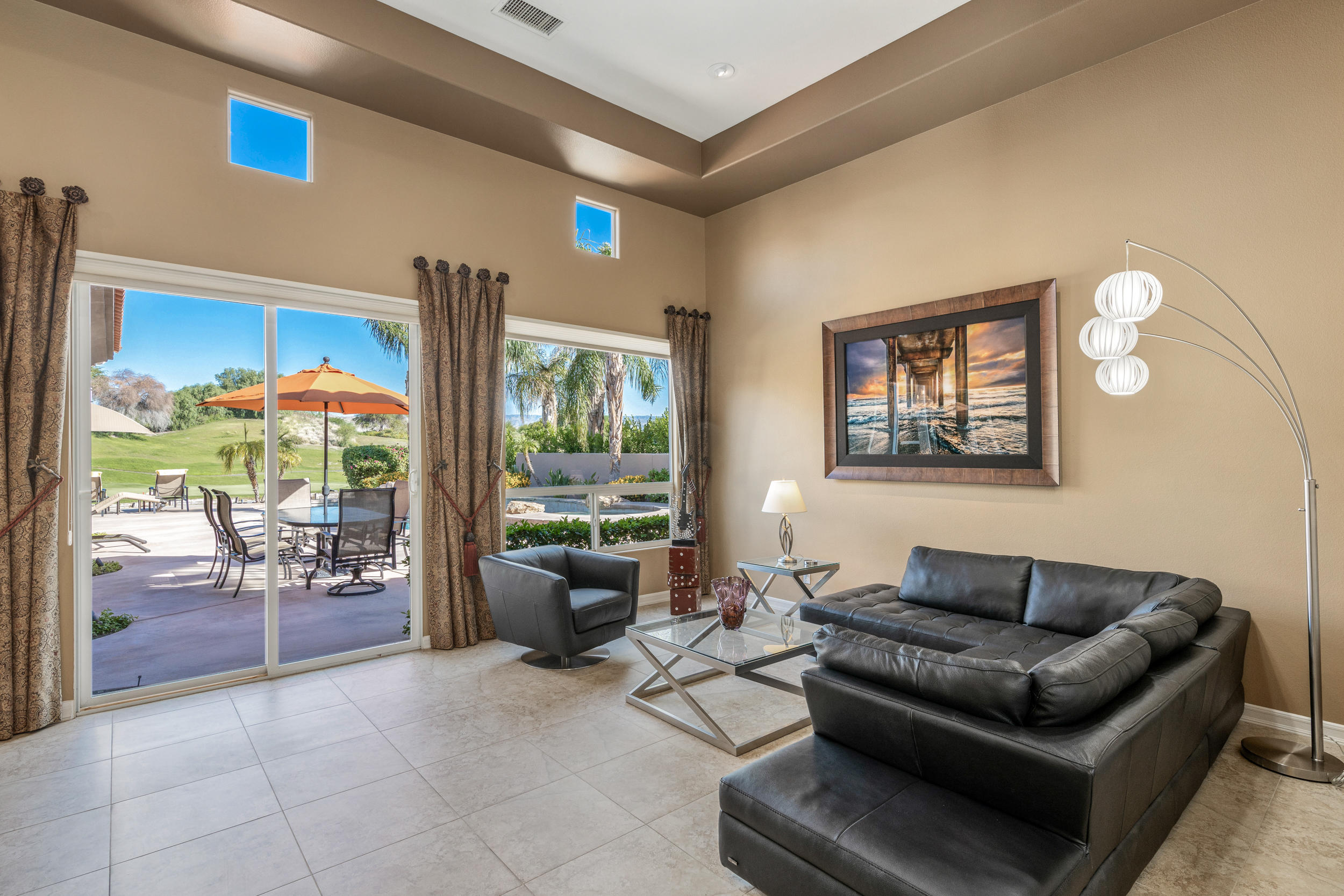 360 Loch Lomond Road Rancho Mirage, CA 92270 - Photo 4 of 76 a living room with furniture and a large window