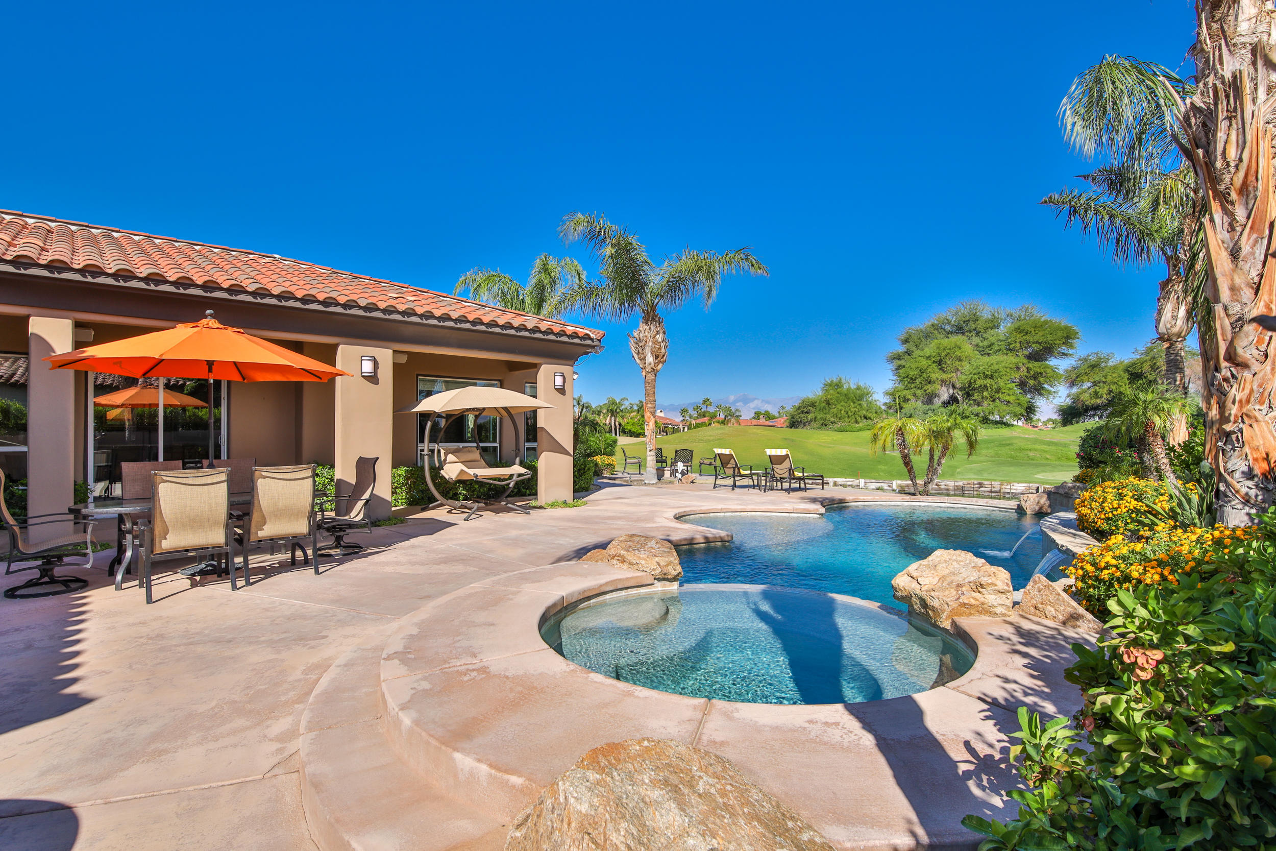 360 Loch Lomond Road Rancho Mirage, CA 92270 - Photo 33 of 76 a view of a swimming pool with a patio