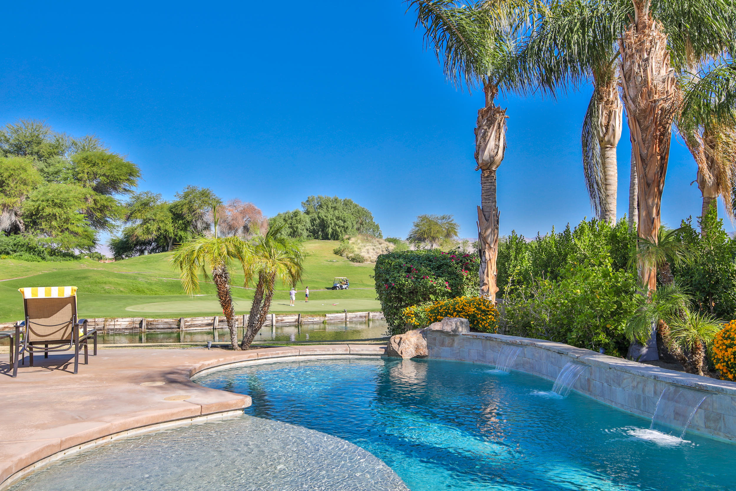 360 Loch Lomond Road Rancho Mirage, CA 92270 - Photo 36 of 76 a view of a swimming pool with a patio
