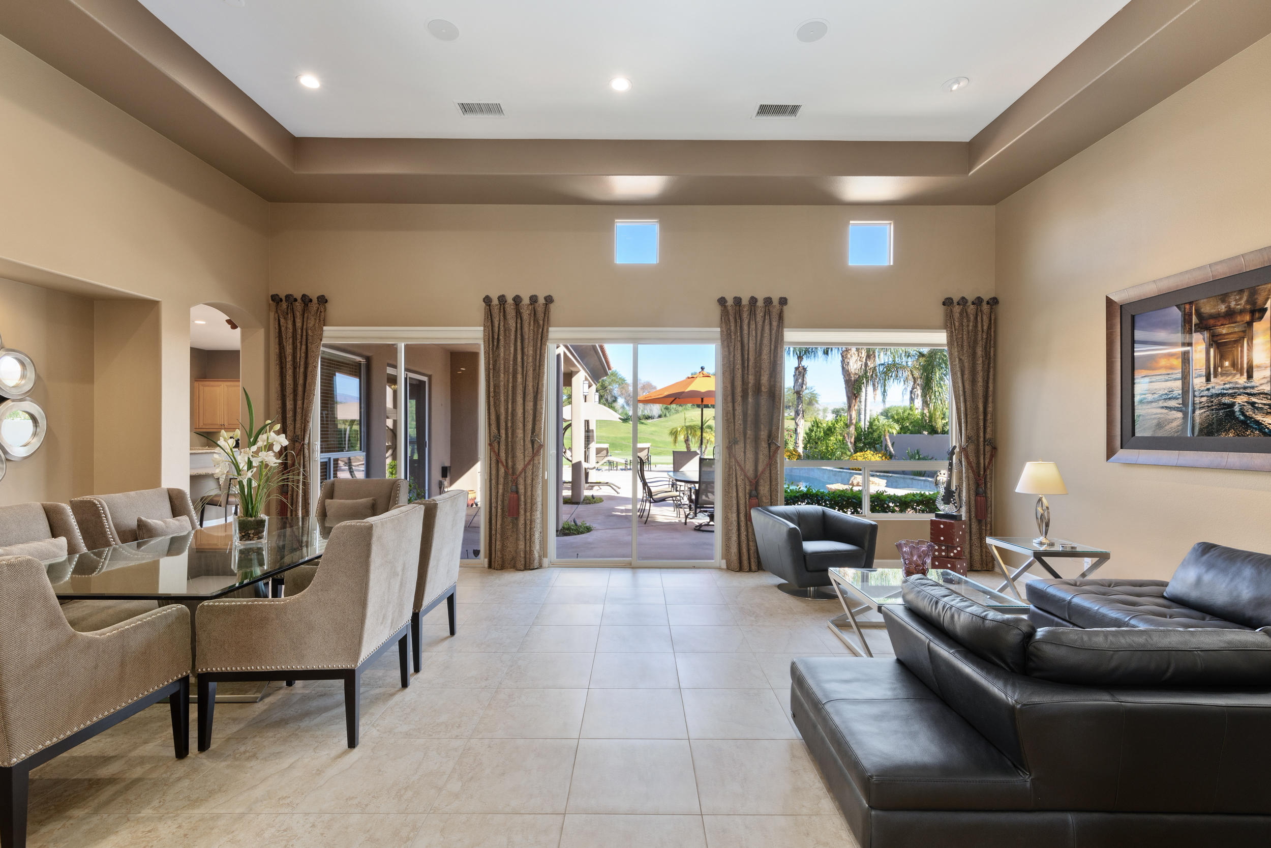 360 Loch Lomond Road Rancho Mirage, CA 92270 - Photo 5 of 76 a living room with furniture and a large window