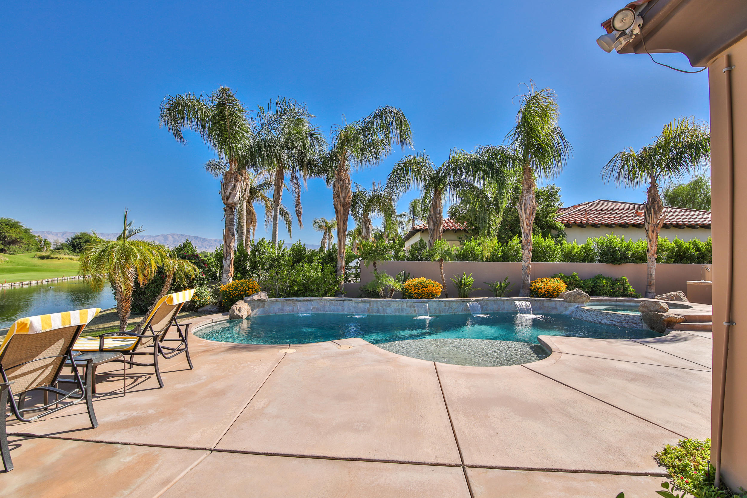 360 Loch Lomond Road Rancho Mirage, CA 92270 - Photo 41 of 76 a view of swimming pool with outdoor seating and plants
