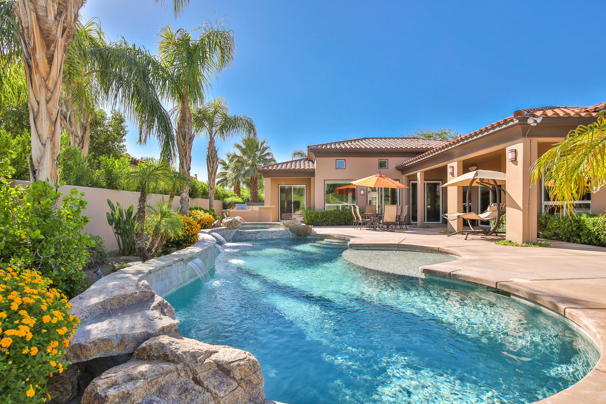 360 Loch Lomond Road Rancho Mirage, CA 92270 - Photo 42 of 76 a view of a house with backyard porch and sitting area