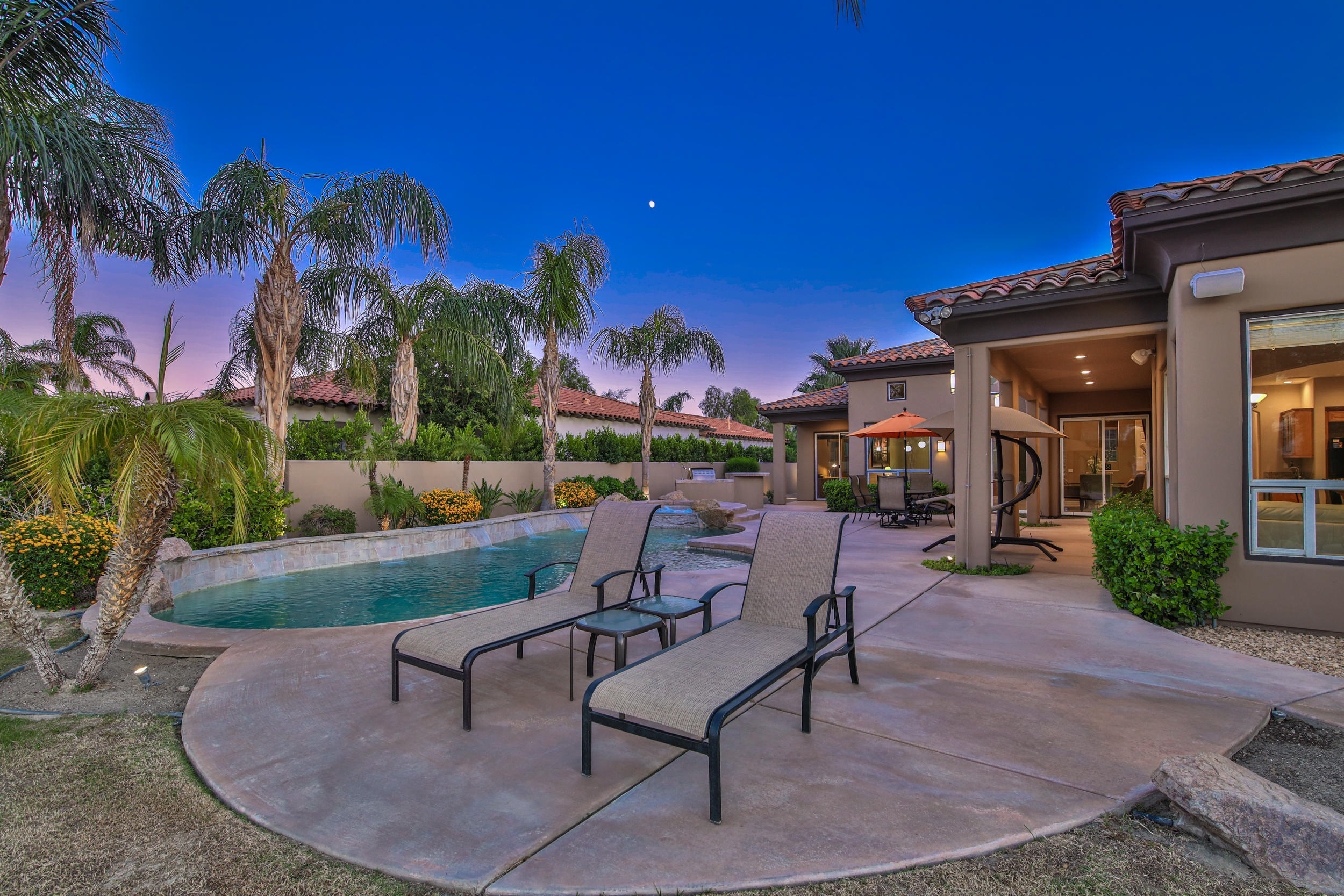 360 Loch Lomond Road Rancho Mirage, CA 92270 - Photo 49 of 76 a view of a backyard with sitting area
