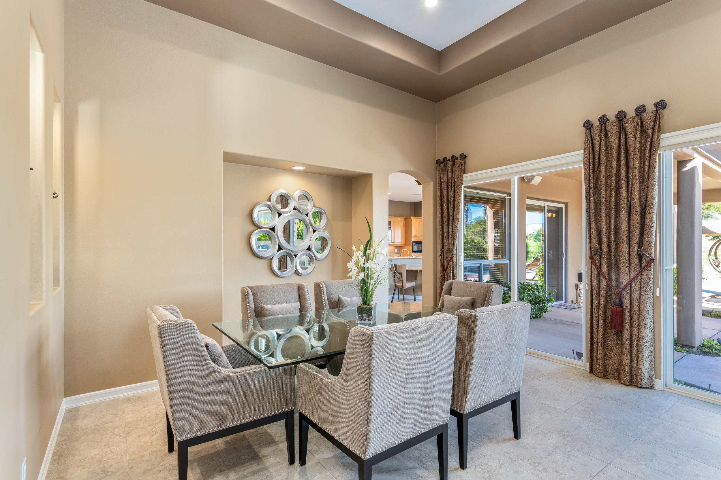 360 Loch Lomond Road Rancho Mirage, CA 92270 - Photo 6 of 76 a dining room with furniture and a floor to ceiling window