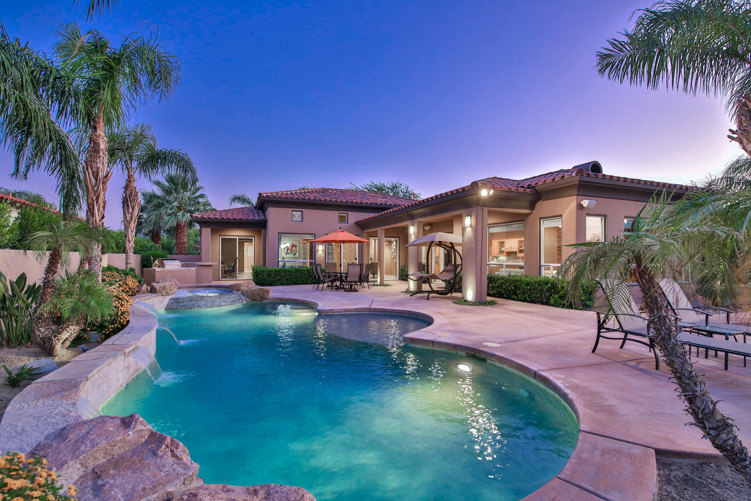 360 Loch Lomond Road Rancho Mirage, CA 92270 - Photo 51 of 76 a swimming pool with outdoor seating and yard