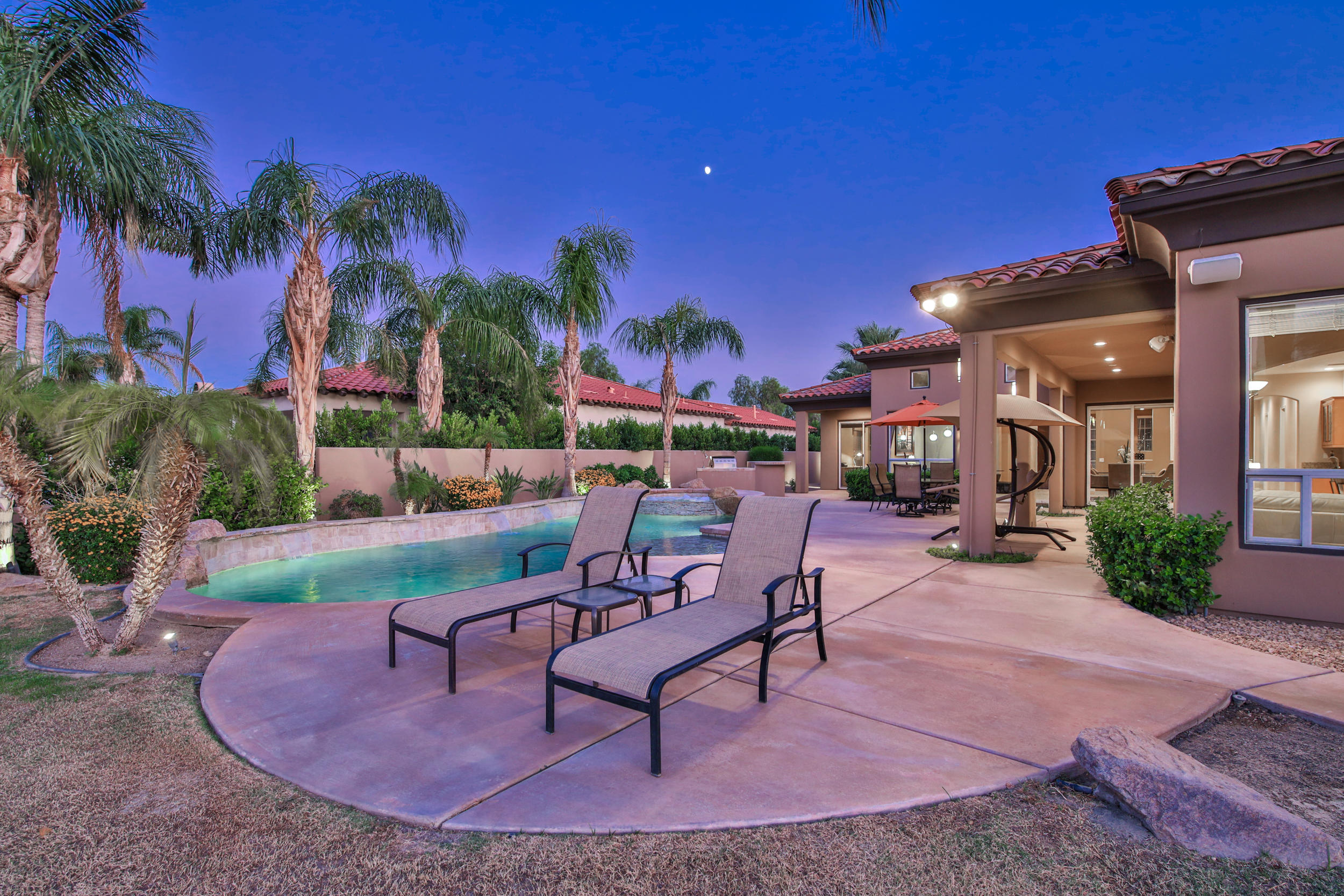 360 Loch Lomond Road Rancho Mirage, CA 92270 - Photo 52 of 76 a view of a backyard with plants and a patio