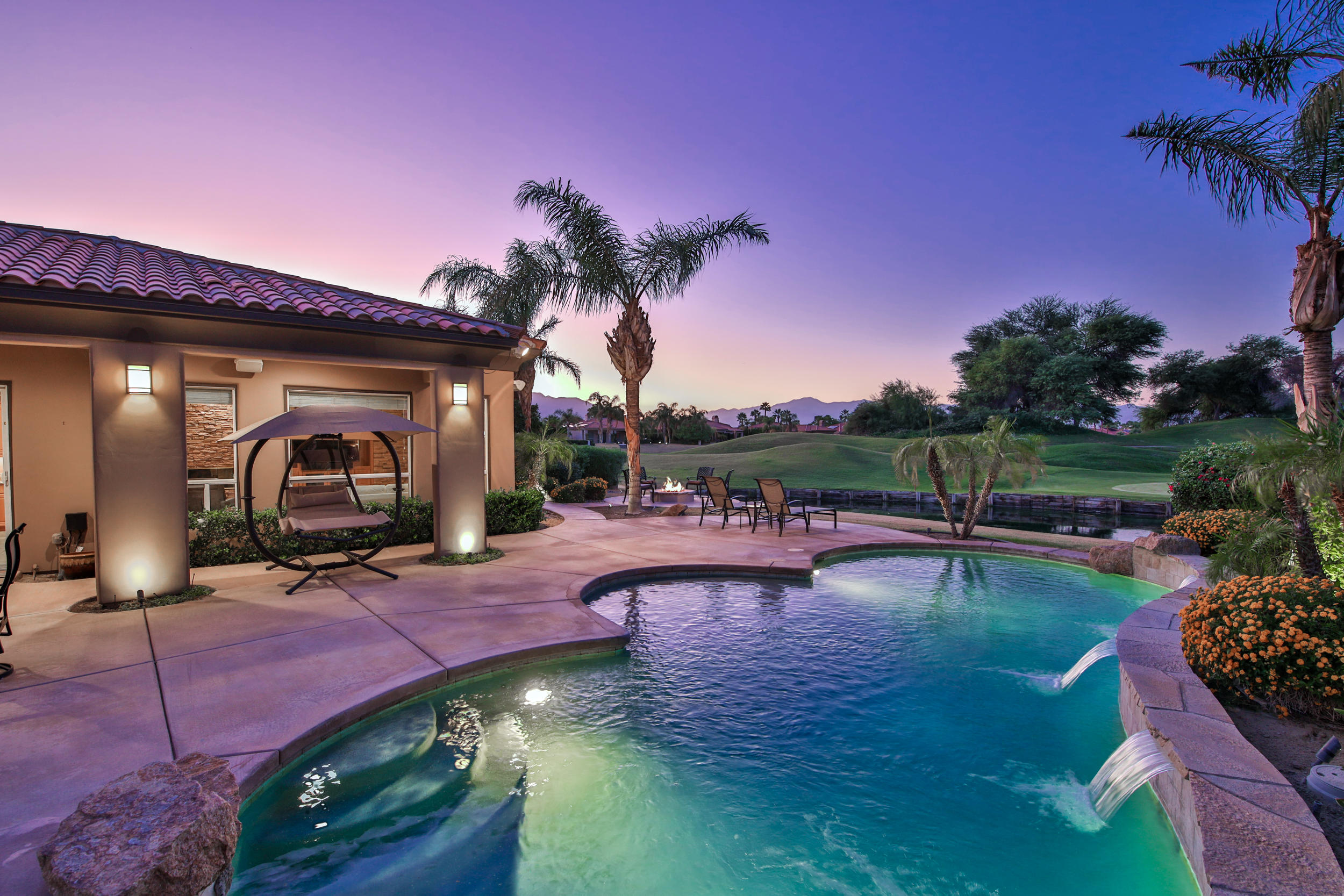 360 Loch Lomond Road Rancho Mirage, CA 92270 - Photo 57 of 76 a view of a swimming pool and lounge chair