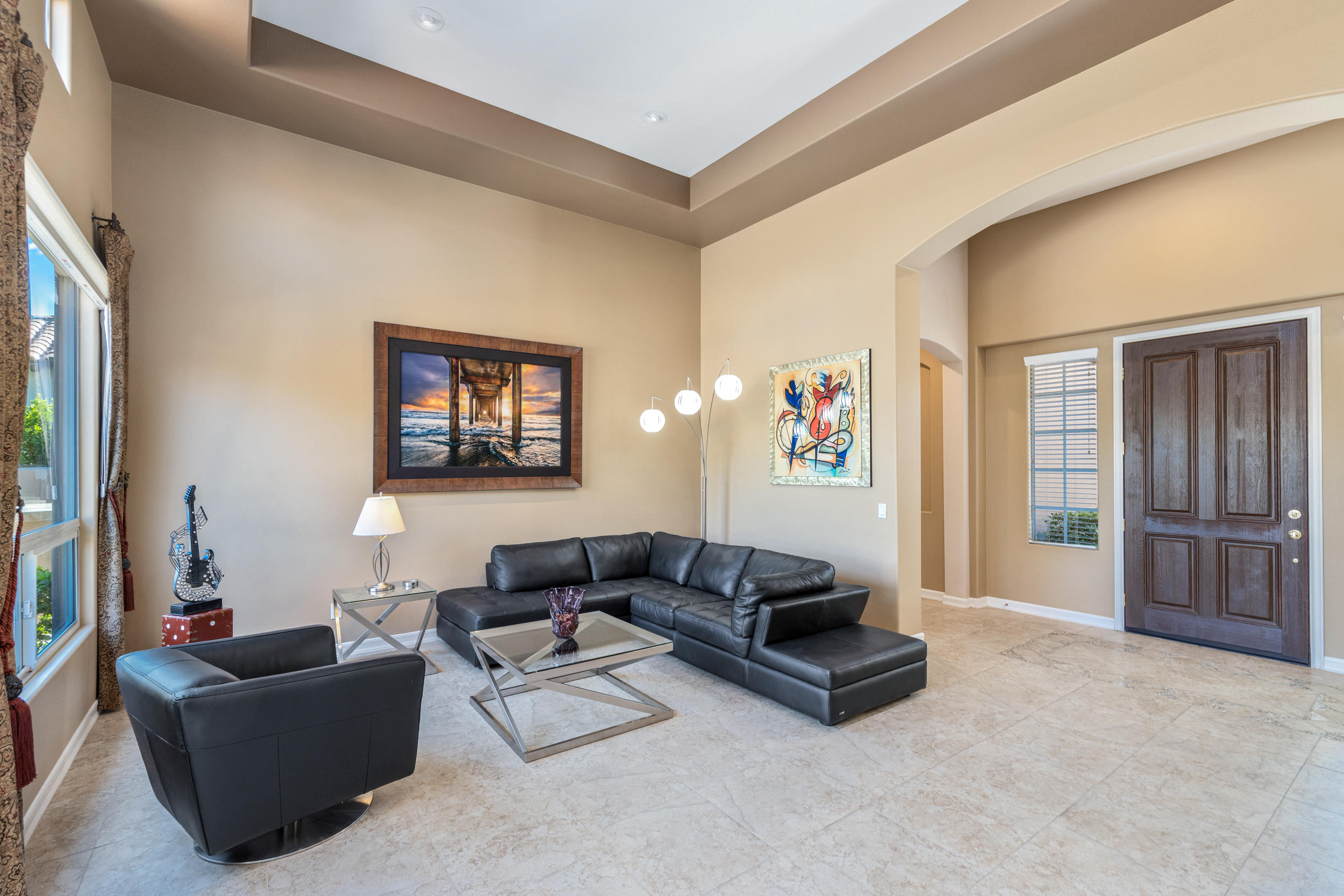 360 Loch Lomond Road Rancho Mirage, CA 92270 - Photo 7 of 76 a living room with furniture and a flat screen tv